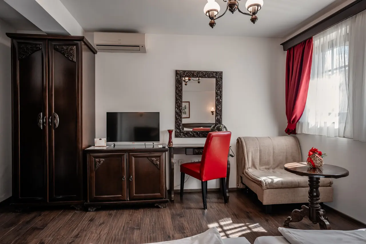 Wardrobe, desk, armchair and window
