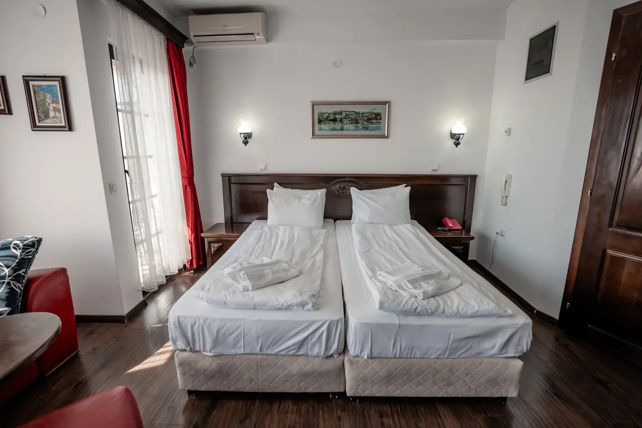Beds with the sofa in the corner