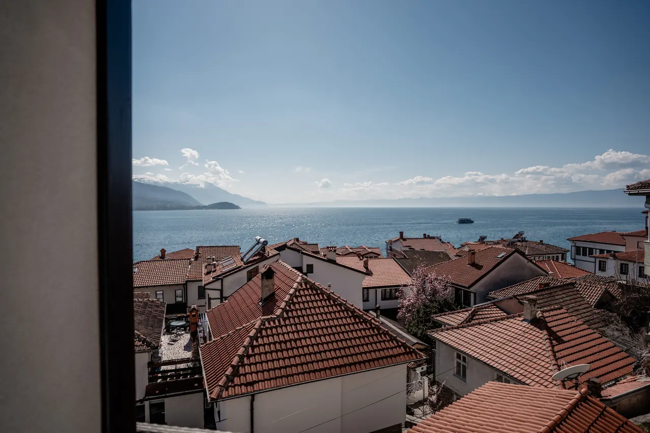 Terracotta rooftops of the old town and Lake Ohrid, seen from a Deluxe Apartment balcony