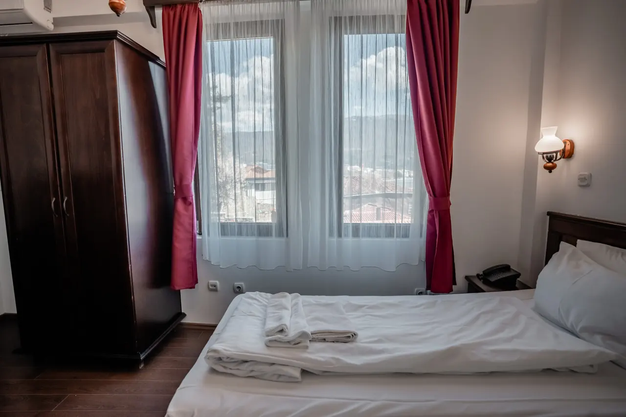 Bed, wardrobe and windows