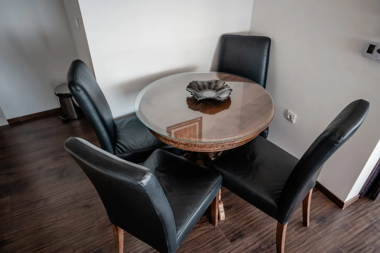 Round dining table with four chairs