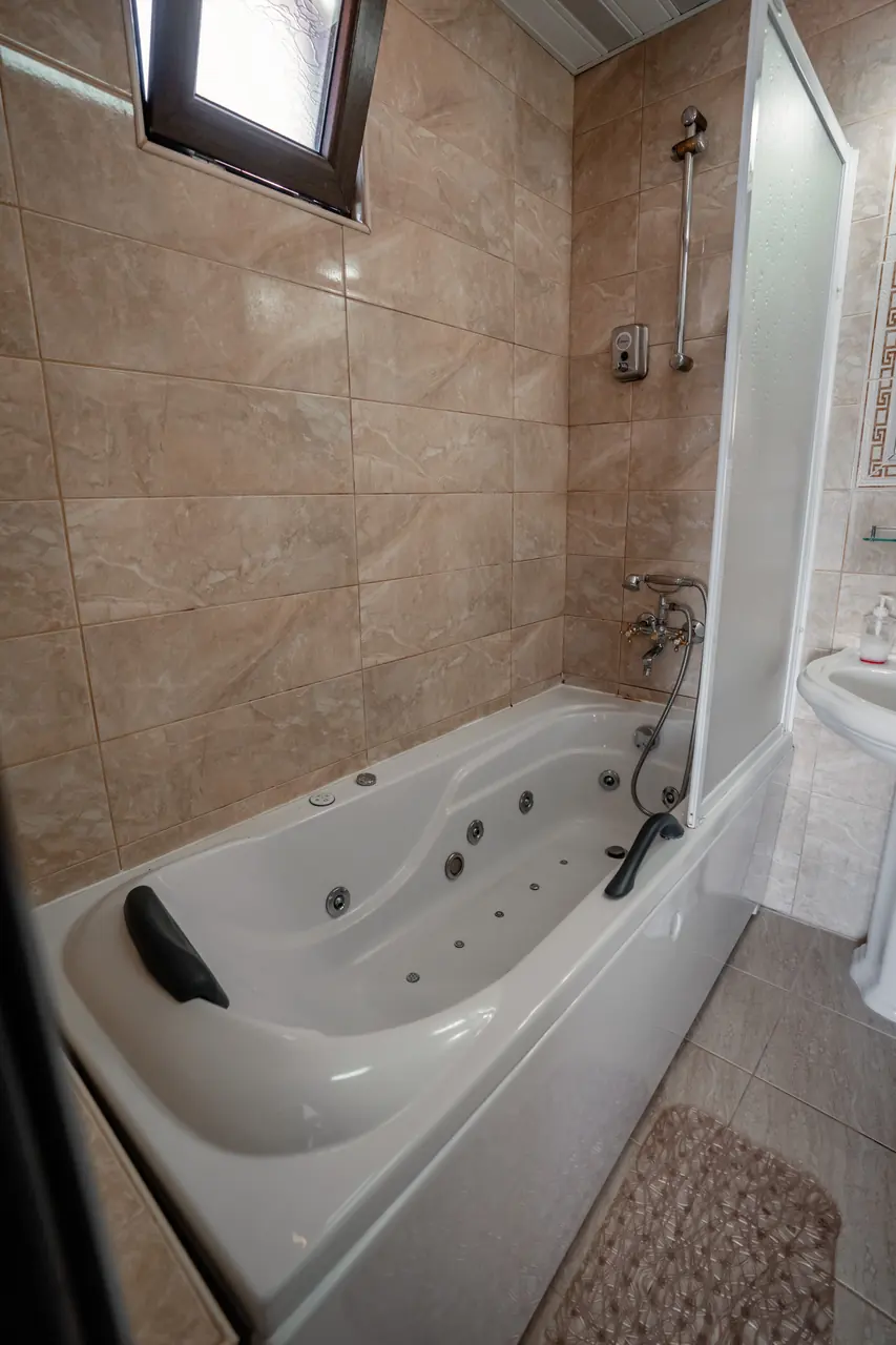 Jacuzzi bathtub, portrait. Shows the suite's signature feature