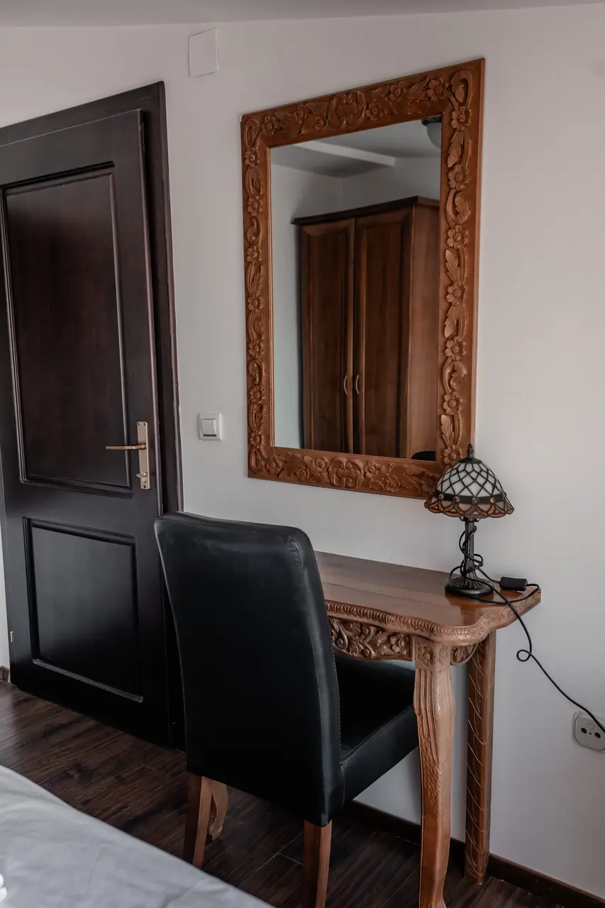 Carved mirror, desk and lamp, portrait